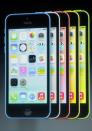 The five colors of the new iPhone 5C are seen on screen at Apple Inc's media event in Cupertino, California September 10, 2013. REUTERS/Stephen Lam (UNITED STATES - Tags: BUSINESS SCIENCE TECHNOLOGY BUSINESS TELECOMS)