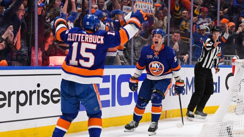 April 21, 2023;  Elmont, New York, USA;  New York Islanders center Casey Cizikas (53) celebrates his goal with right wing Cal Clutterbuck (15) against the Carolina Hurricanes during the second period in game three of the first round of the 2023 Stanley Cup Playoffs at UBS Arena.