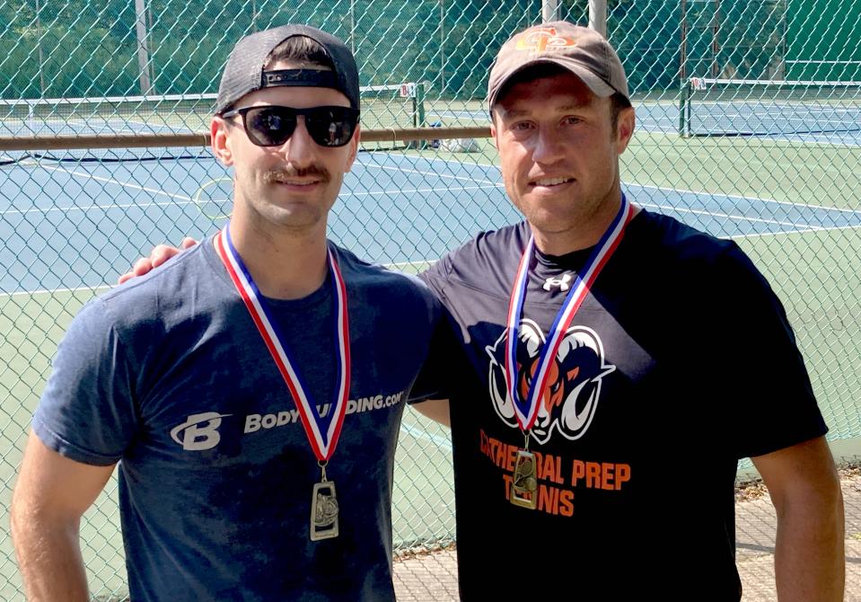Edinboro University tennis coach Kody Duncan, left, and Cathedral Prep boys tennis coach Pat Grab pose after their men's singles final during Sunday's City Rec Tennis Tournament. Grab, thanks to his 6-3, 6-3 victory, won that division for a tournament-record sixth time.