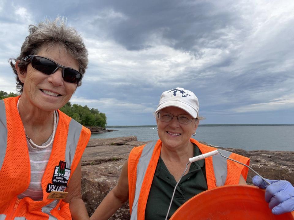 Heidi Wasson, left, and Nancy Gilliom stand along the shore of Lake Superior at Madeline Island's Big Bay State Park where they were working as camp hosts.