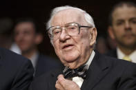 FILE - In this April 30, 2014, file photo, retired Supreme Court Justice John Paul Stevens prepares to testify on the ever-increasing amount of money spent on elections as he appears before the Senate Rules Committee on Capitol Hill in Washington. Stevens, the bow-tied, independent-thinking, Republican-nominated justice who unexpectedly emerged as the Supreme Court's leading liberal, died July 16, 2019, in Fort Lauderdale, Fla., after suffering a stroke. He was 99. (AP Photo, File)