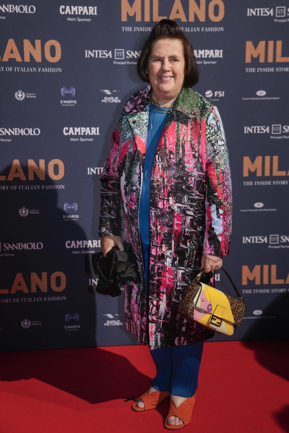 Suzy Menkes poses for photographers upon arrival for the premiere of the film 'Milano, the inside story of Milan Fashion' in Milan, Italy, Sunday, Feb. 26, 2023. (AP Photo/Luca Bruno)