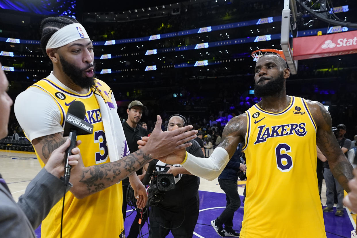 Los Angeles Lakers' LeBron James, right, congratulates forward Anthony Davis after the Lakers defeated the Golden State Warriors 104-101 in Game 4 of the Western Conference semifinal series on May 8, 2023, in Los Angeles. (AP Photo/Marcio Jose Sanchez)