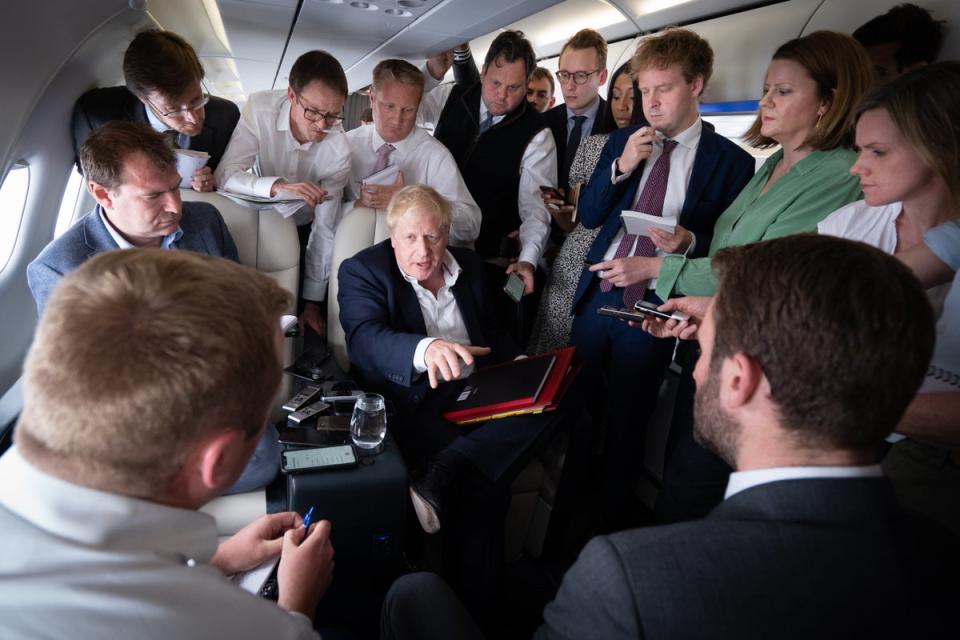 Prime Minister Boris Johnson talks to journalists on his plane during a flight from Germany where he was attending the G7 Summit to the Nato summit (Stefan Rousseau/PA) (PA Wire)