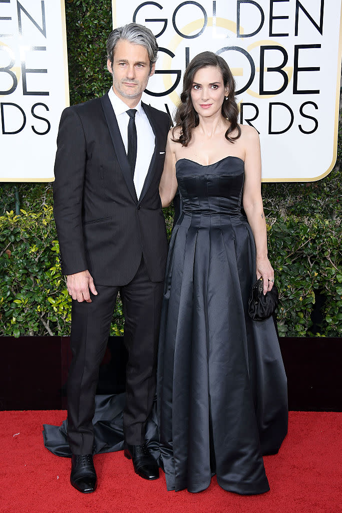 <p>Winona Ryder, 45, looked elegant and youthful in a vintage, floor-length Viktor & Rolf black gown. Her partner Scott Mackinlay Hahn looked equally dapper. </p>