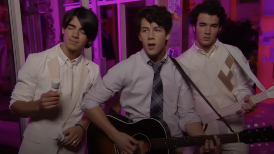 Joe, Nick and Kevin Lucas perform a song on Jonas