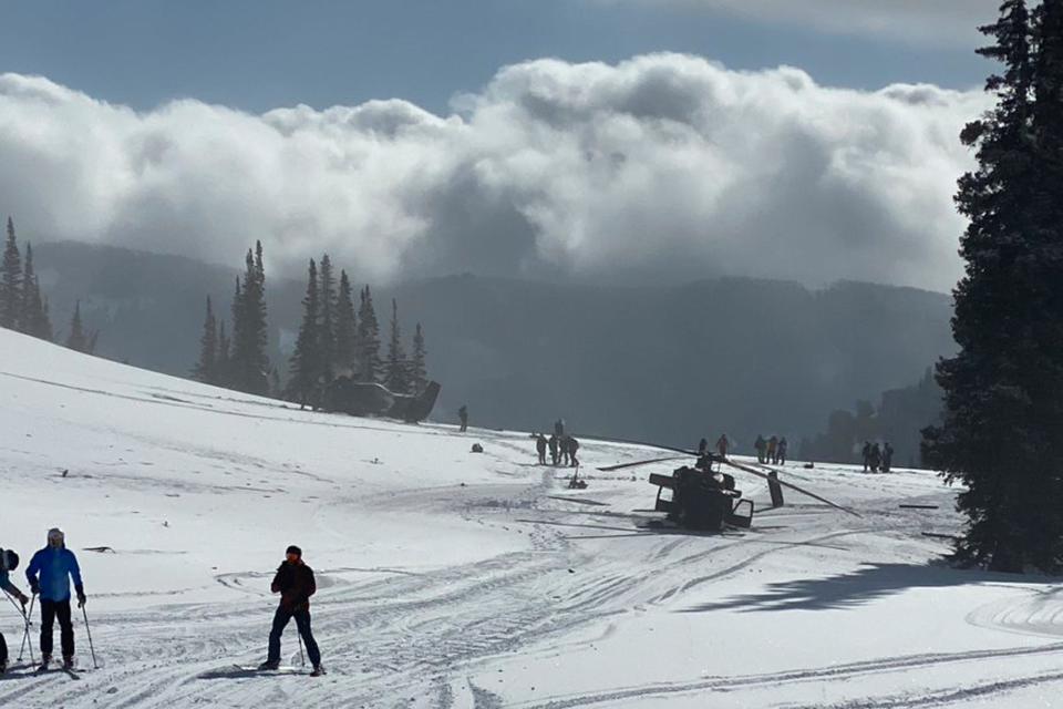 In this photo provided by @LifterMike93 is the scene where a pair of Utah National Guard helicopters were involved in an accident near Snowbird Ski Resort in Snowbird, Utah on Tuesday, February 22, 2022.