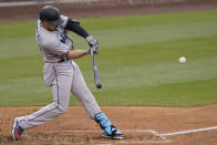 CORRECTS TO PABLO LOPEZ NOT PANLO LOPEZ - Miami Marlins' Adam Duvall (14) hits a home run during the fifth inning of a baseball game against the Los Angeles Dodgers, Sunday, May 16, 2021, in Los Angeles. Pablo Lopez and and Jazz Chisholm Jr. also scored. (AP Photo/Ashley Landis)