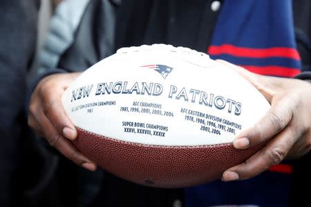 Feb 4, 2015; Boston, MA, USA; A New England Patriots fan holds a football during the Super Bowl XLIX-New England Patriots Parade. Greg M. Cooper-USA TODAY Sports