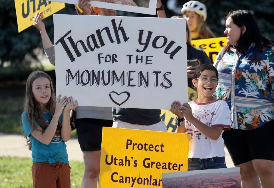 Eisley Cope and Catalina Reynolds hold a “Thank you for the Monuments” sign as they wait on 500 South for President Joe Biden’s motorcade to pass on the way to the George E. Wahlen Department of Veterans Affairs Medical Center, where he will deliver remarks, in Salt Lake City on Thursday, Aug. 10, 2023. | Kristin Murphy, Deseret News