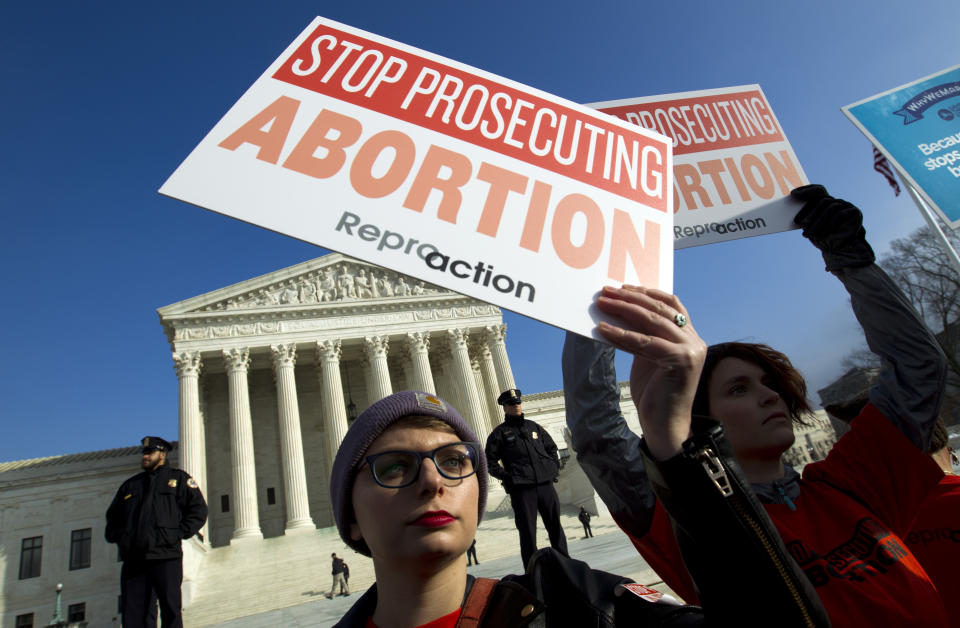 FILE - In this Jan. 18, 2019, file photo, abortion rights activists protest outside of the U.S. Supreme Court, during the March for Life in Washington. The passage of abortion restrictions in Republican-led states and a corresponding push to buttress abortion rights where Democrats are in power stem from the same place: Changes in the composition of the high court. (AP Photo/Jose Luis Magana, File)