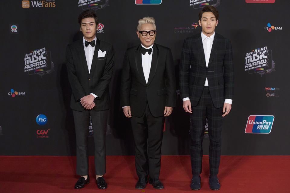 South Korean singers Kwak Jin-eon, Yoon Jong-shin and Kim Feel pose on the red carpet as they attend the 2014 Mnet Asian Music Awards (MAMA) in Hong Kong