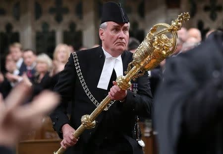 Sergeant-at-Arms Kevin Vickers is applauded in the House of Commons in Ottawa October 23, 2014. REUTERS/Chris Wattie