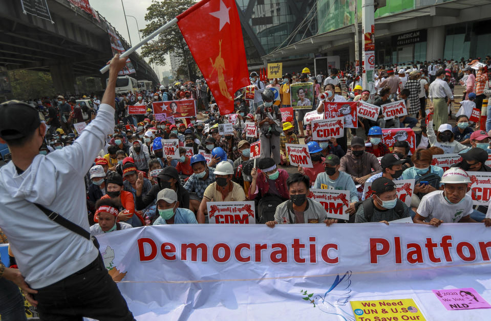 Demonstrators hold pictures of deposed Myanmar leader Aung San Suu Kyi and placards during a protest against the military coup in Yangon, Myanmar Thursday, Feb. 18, 2021. Demonstrators against Myanmar’s military takeover returned to the streets Thursday after a night of armed intimidation by security forces in the country’s second biggest city. (AP Photo)