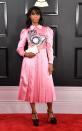 <p>A pink satin dress with snake detailing is perfectly fitting for Santigold. </p>