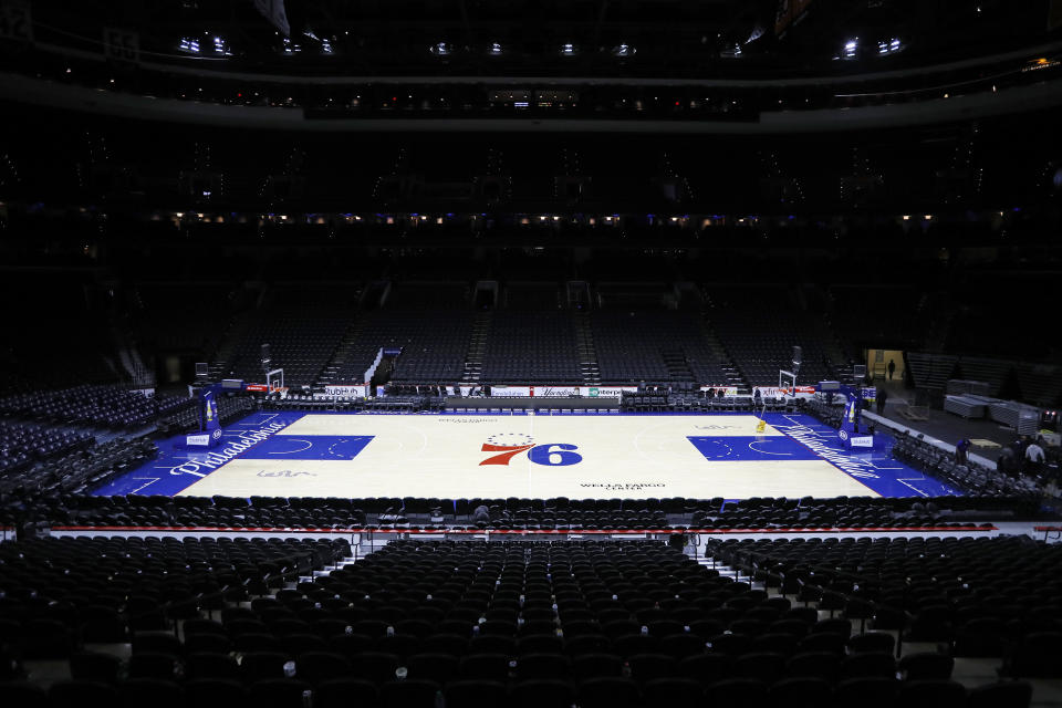 The empty court is seen at the Wells Fargo Center after an NBA basketball game between the Philadelphia 76ers and the Detroit Pistons, Wednesday, March 11, 2020, in Philadelphia. (AP Photo/Matt Slocum)