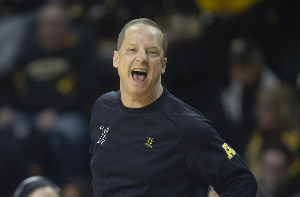 Wichita State coach Paul Mills yells instruction stop his players during the first half of an NCAA college basketball game against Florida Atlantic on Sunday, Feb., 11, 2024, in Wichita, Kan. (Travis Heying/The Wichita Eagle via AP)