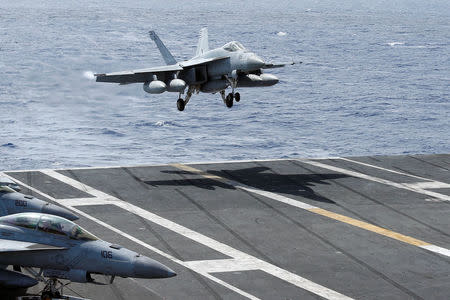 An F/A-18 Super Hornet lands on the deck of the USS Ronald Reagan in the South China Sea September 30, 2017. REUTERS/Bobby Yip