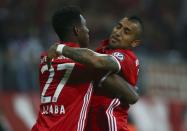 Football Soccer - Bayern Munich v FC Augsburg - German Cup (DFB Pokal) - Allianz Arena, Munich, Germany - 26/10/16 - Bayern's David Alaba and Arturo Vidal react after scoring a goal. REUTERS/Michael Dalder