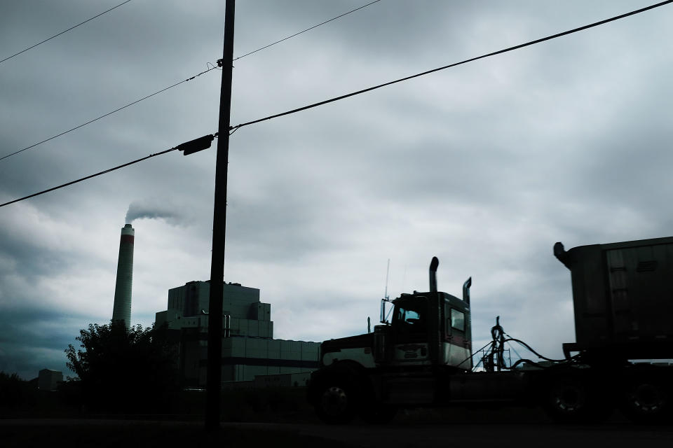 MAIDSVILLE, WV - AUGUST 21:  A truck drives by the Longview Power Plant,  a coal-fired plant, stands on August 21, 2018 in Maidsville, West Virginia. The plant's single unit generates 700 net megawatts of electricity from run-of-mine coal and natural gas. In a stop in West Virginia tonight, President Donald Trump is expected to announce a proposal to allow states to set their own emissions standards for coal-fueled power plants. Environmental activists say this would be a massive blow to reducing carbon emissions.  (Photo by Spencer Platt/Getty Images)