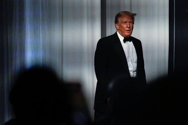 Former President Donald Trump takes the stage to speak at an event at Mar-a-Lago, Friday, Nov. 18, 2022, in Palm Beach, Fla