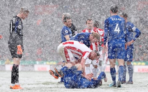 Charlie Adam checks on Everton's Wayne Rooney after fouling him  - Credit: Reuter