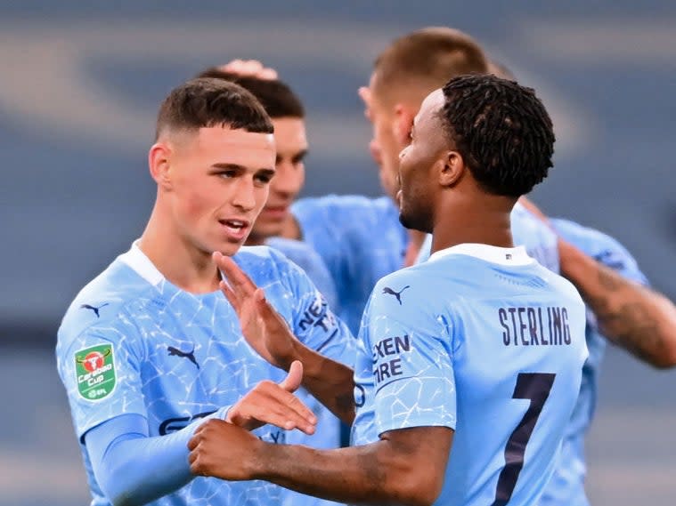Phil Foden celebrates with teammates after scoring (Getty)