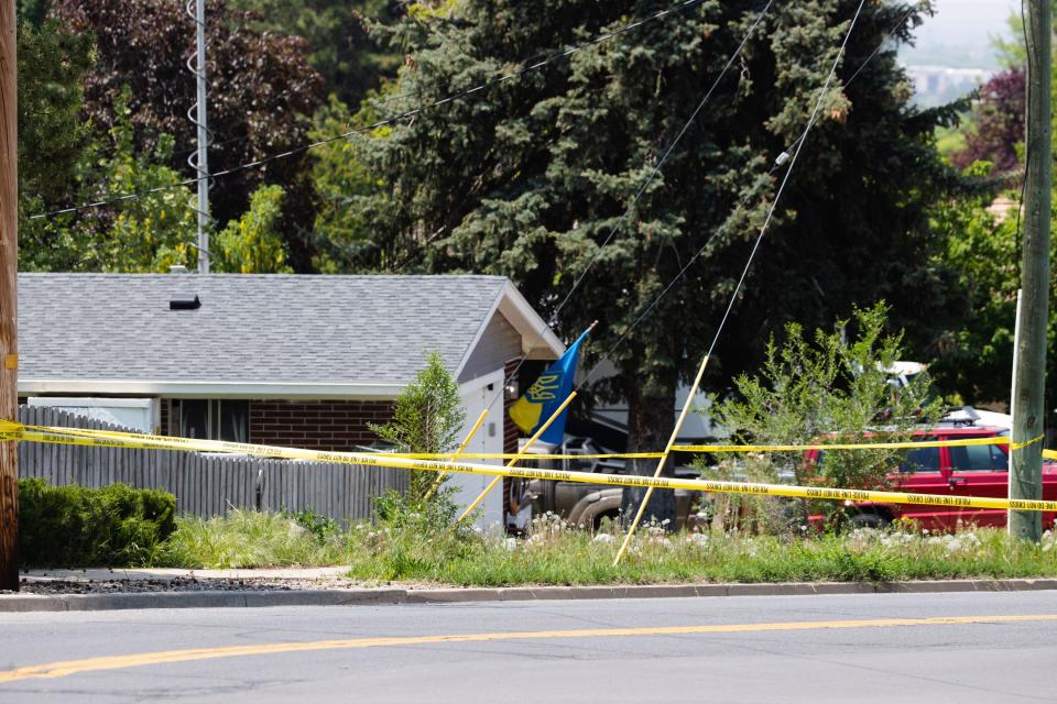 Police tape is seen blocking off the scene of a triple homicide in Layton on May 19, 2023. | Ryan Sun, Deseret News