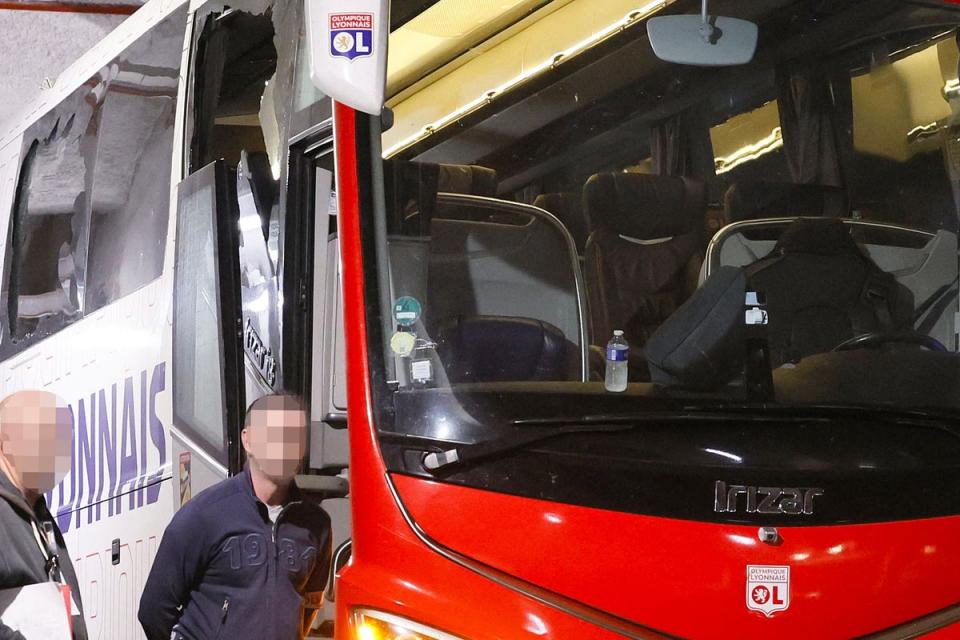 Lyon’s bus was damaged after arriving at Stade Velodrome  (AFP via Getty Images)