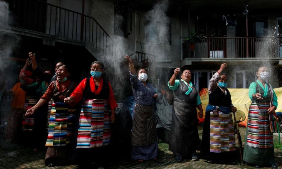 Tibetans at a ceremonial  86th birthday celebration for the Dalai Lama in Lalitpur, Nepal.