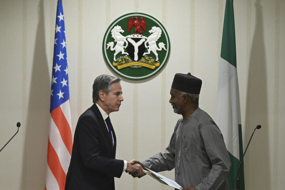 US Secretary of State Antony Blinken, left, shakes hands with Nigeria's Minister of Foreign Affairs Yusuf Tuggar after a press conference at the Presidential Villa, in Abuja, Nigeria, Tuesday, Jan. 23, 2024. (Andrew Caballero-Reynolds/Pool Photo via AP)