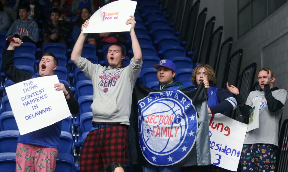 Blue Coats fans, from left, Daniel Leakan, Ben Nicholas, John Halwood, Connor Strauss and Jake Clark cheer Mac McClung as the NBA slam dunk contest winner makes his return to the Blue Coats in a G League game at the Chase Fieldhouse on Wednesday, Feb. 22, 2023.