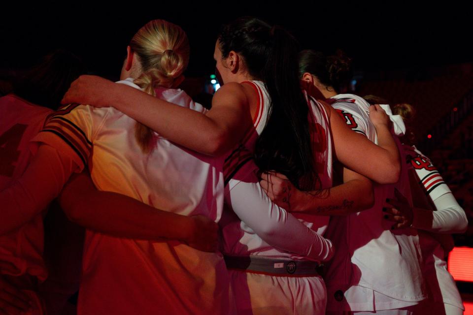 Utah Utes players circle up before the women’s college basketball game against Weber State in Salt Lake City on Dec. 21, 2023.