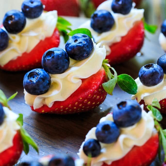 <strong>Get the <a href="https://spicysouthernkitchen.com/red-white-blue-cheesecake-strawberries/" target="_blank">Red, White And Blue Cheesecake Strawberries recipe</a>&nbsp;from Spicy Southern Kitchen</strong>