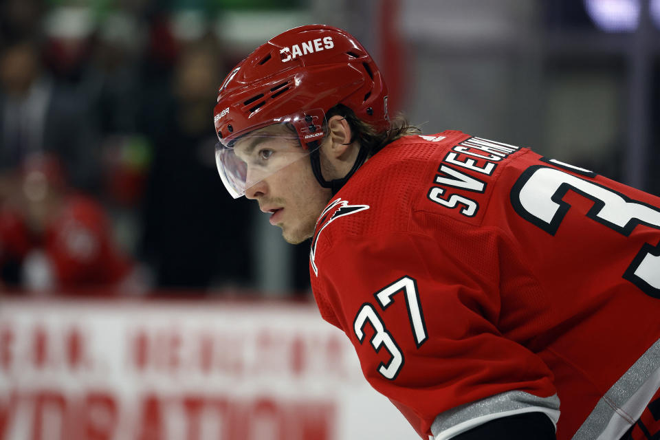 FILE - Carolina Hurricanes' Andrei Svechnikov (37) watches the puck against the Philadelphia Flyers during the third period of an NHL hockey game in Raleigh, N.C., Thursday, March 9, 2023. Svechnikov can only watch as his team begins a fifth straight trip to the NHL playoffs, as he faces months of recovery from knee surgery following an injury in March. (AP Photo/Karl B DeBlaker, File)