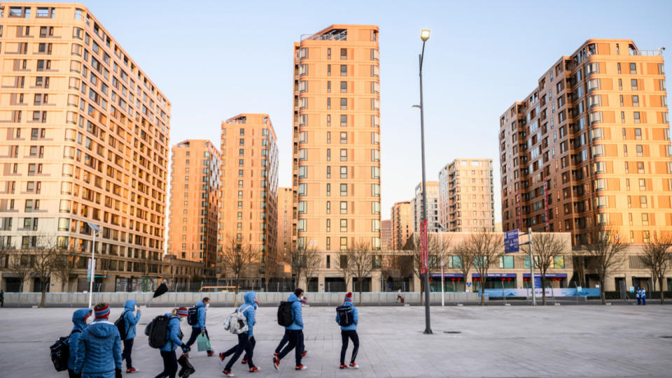 Members of Team Norway walk toward their accommodation buildings as they arrive at the Olympic Village ahead of the Beijing 2022 Winter Olympic Games on February 1, 2022 in Beijing, China.