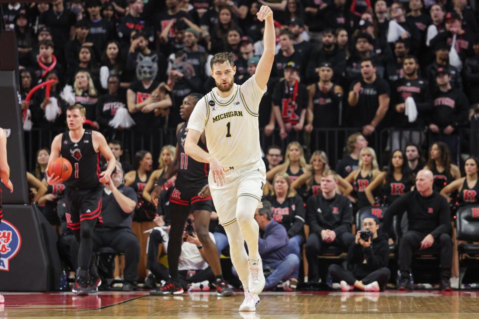 Michigan Wolverines center Hunter Dickinson (1) celebrates after a basket against the Rutgers Scarlet Knights during the second half at Jersey Mike's Arena.