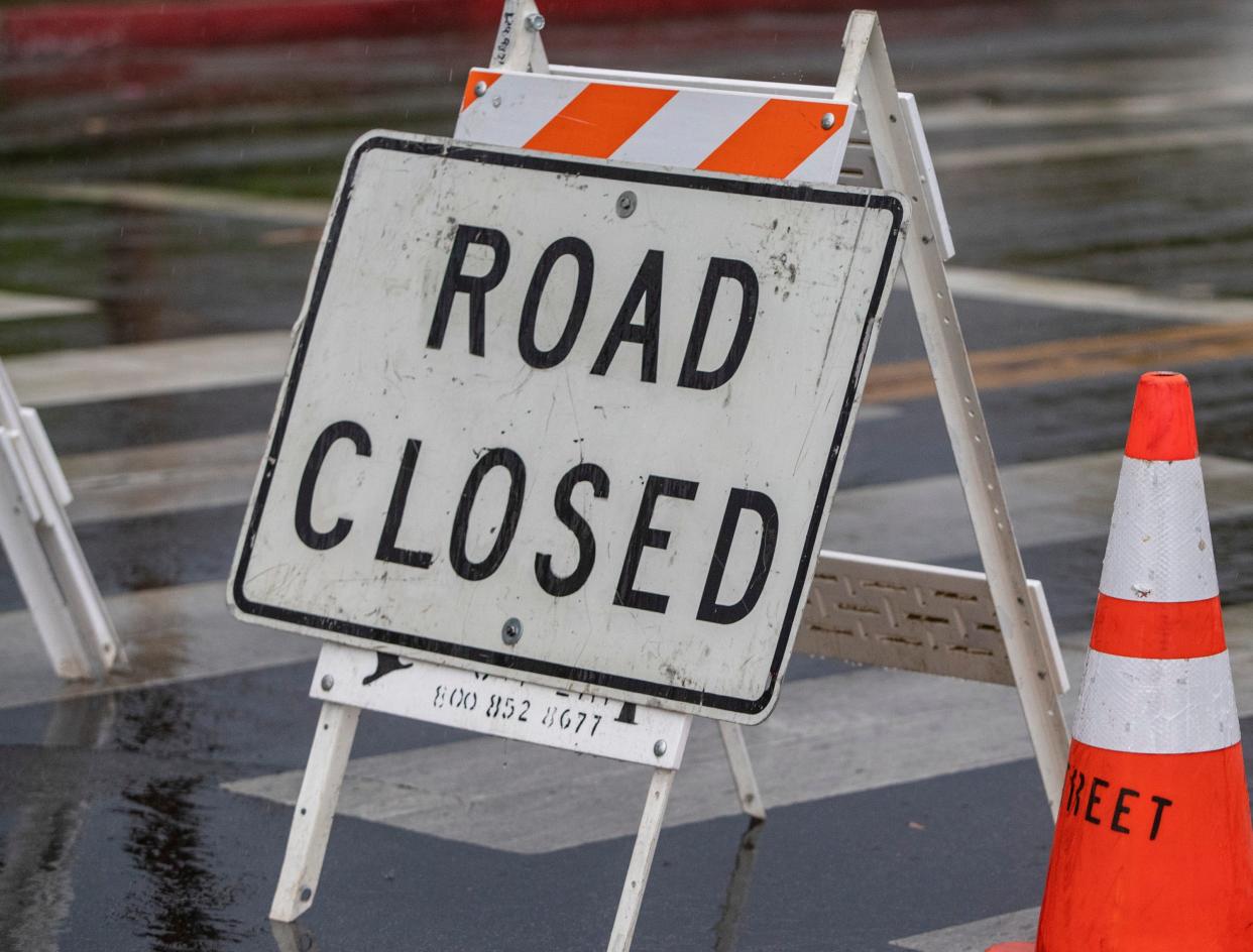 A road closed sign on North Indian Canyon Drive.