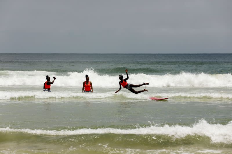 Wider Image: Meet Senegal's first female pro surfer inspiring girls to take to the waves