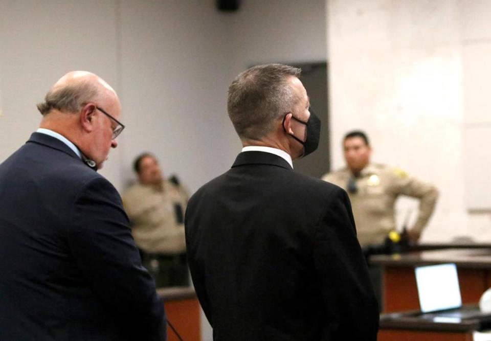 Defense attorney Robert Sanger, left, and his client, Paul Flores, react after a jury found Flores guilty of murdering Cal Poly student Kristin Smart. The jury’s verdict was read in Monterey County Superior Court on Tuesday, Oct. 18, 2022, following a trial.