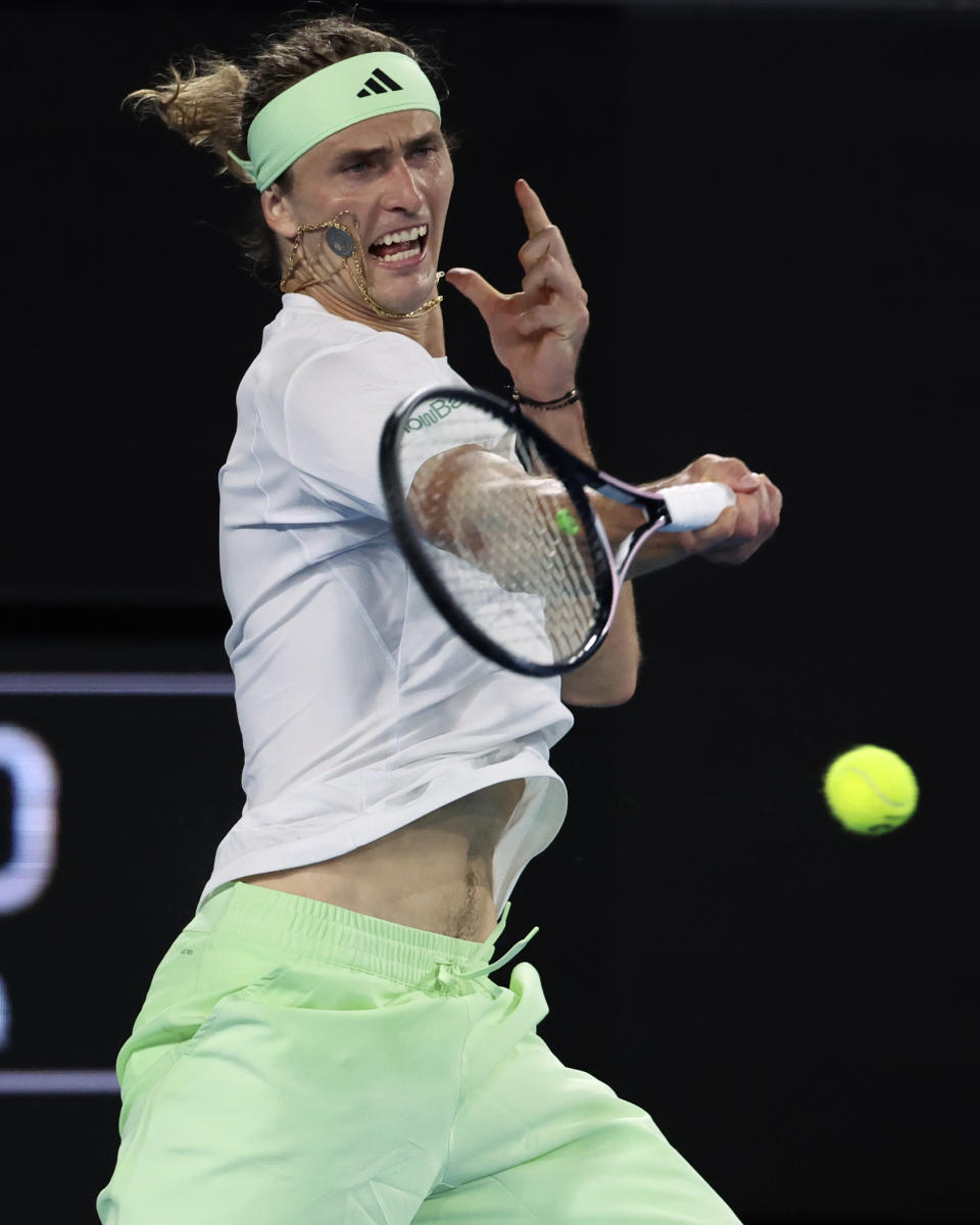 Alexander Zverev of Germany plays a forehand return to compatriot Dominik Koepfer during their first round match at the Australian Open tennis championships at Melbourne Park, Melbourne, Australia, Tuesday, Jan. 16, 2024. (AP Photo/Asanka Brendon Ratnayake)
