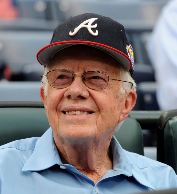 FILE PHOTO: Former U.S. President Carter watches opening ceremonies at the start of the Atlanta Braves' home opening MLB baseball game against the Philadelphia Phillies in Atlanta