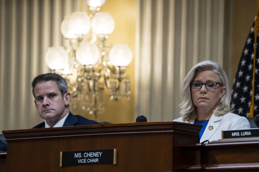 WASHINGTON, DC - JULY 21: Rep. Adam Kinzinger (R-IL) and Vice Chair Rep. Liz Cheney (R-WY) listen during a hearing of the House Select Committee to Investigate the January 6th Attack on the United States Capitol in the Cannon House Office Building on Thursday, July 21, 2022 in Washington, DC. The bipartisan Select Committee to Investigate the January 6th Attack On the United States Capitol has spent nearly a year conducting more than 1,000 interviews, reviewed more than 140,000 documents day of the attack. (Kent Nishimura / Los Angeles Times)