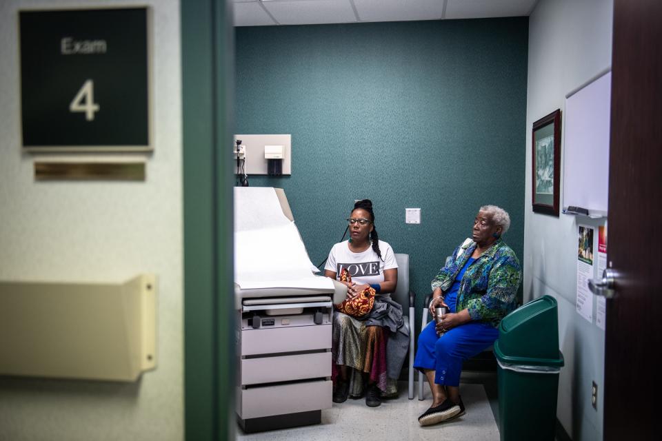 Glenis Redmond, the poet-in-residence at the Peace Center in Greenville, sits with her mother Jeanette Redmond, at the Prisma Health Cancer Institute Monday, August 13, 2019, during her second treatment session for advanced multiple myeloma, a cancer of the blood, which she was recently diagnosed with.