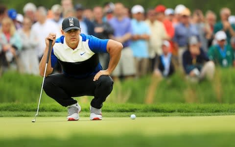 Brooks Koepka of the United States lines up a putt on the second green during the final round of the 2019 PGA Championship at the Bethpage Black course - Credit: Getty images