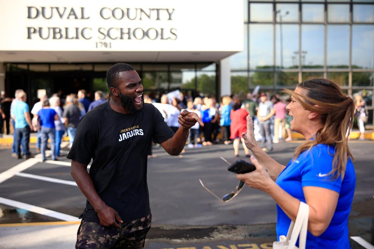 Carnell Oiver, left, gets into an exchange with Darby Mueller over Florida's Parental Rights in Education Bill during a may protest at the Duval County Public Schools building. Partisan politics are increasingly playing a role in nonpartisan School Board elections, including two races on the ballot in Duval County this month.