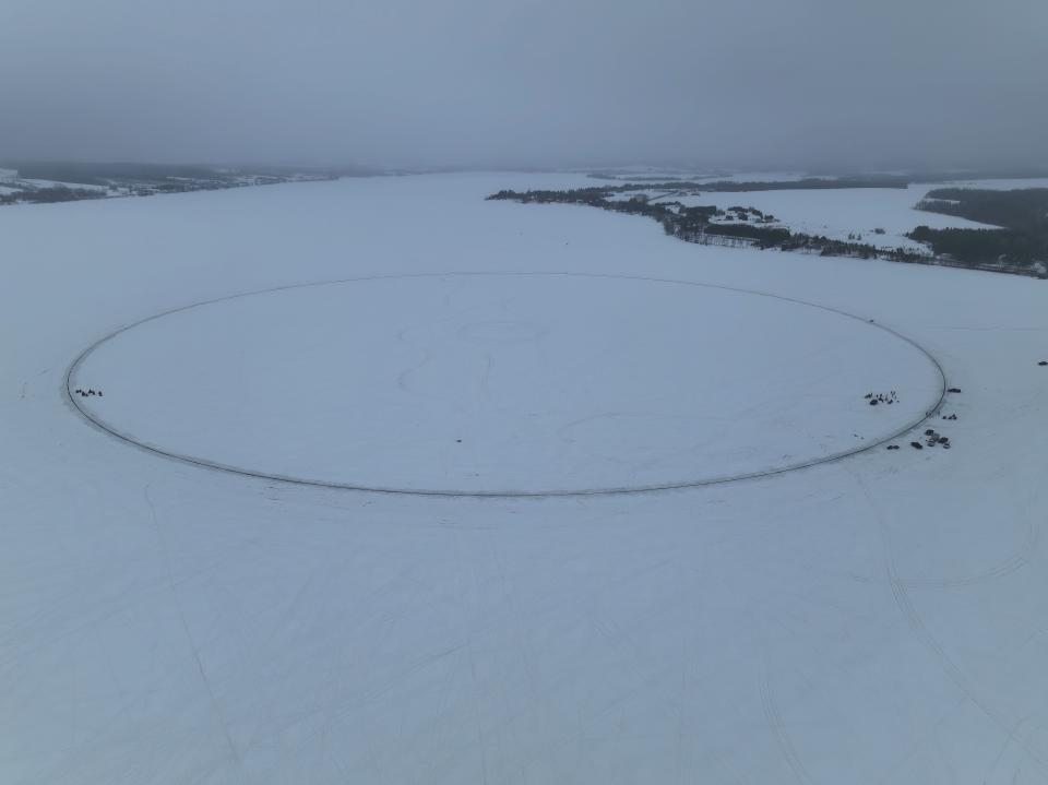 This photo provided by Aroostook UAS shows a giant ice disk that measures 1,776 feet – or 541 meters– is seen on the day it was set in motion, creating the world’s largest ice carousel, on Saturday, April 1, 2023, in Long Lake in Madawaska, Maine.