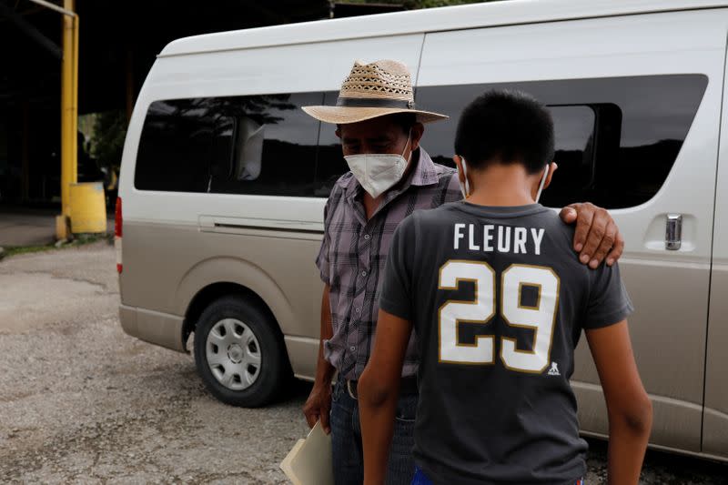 Juan shares a moment with his disabled 12-year-old son Gustavo, who was expelled by U.S. authorities to Guatemala under an emergency health order, during their reunion in Peten