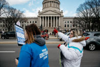 <p>Striking teachers stand on a small picket line outside the West Virginia Capitol in Charleston, W.Va., on Friday, March 2, 2018. (Photo: Scott Heins/Bloomberg via Getty Images) </p>