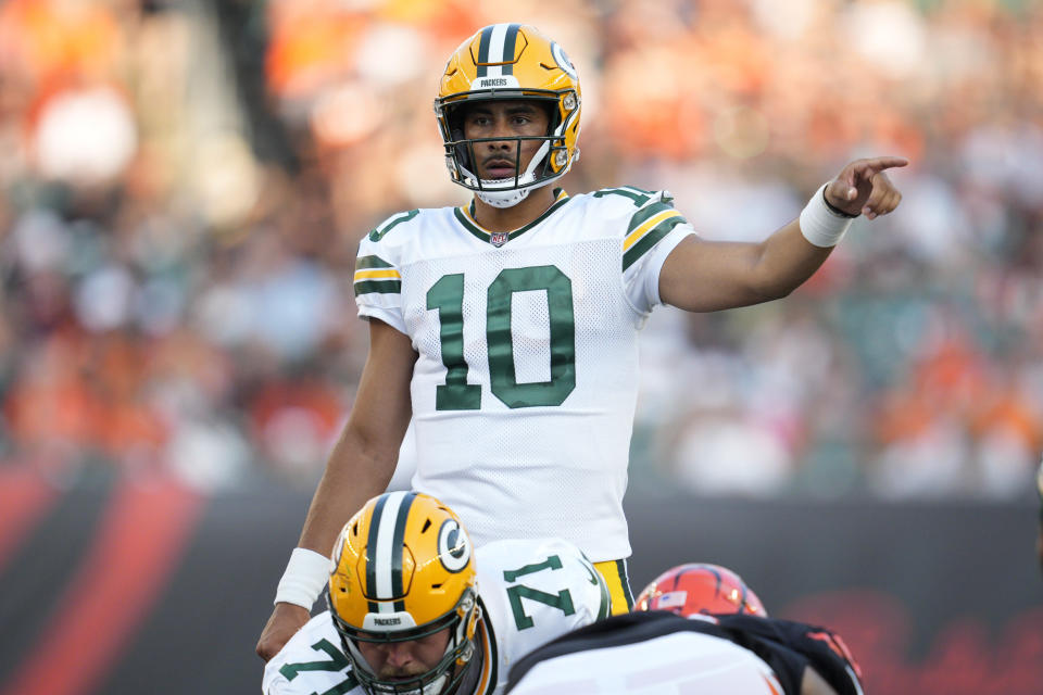 Green Bay Packers quarterback Jordan Love signals against the Cincinnati Bengals during the first half of a preseason NFL football game Friday, Aug. 11, 2023, in Cincinnati. (AP Photo/Michael Conroy)